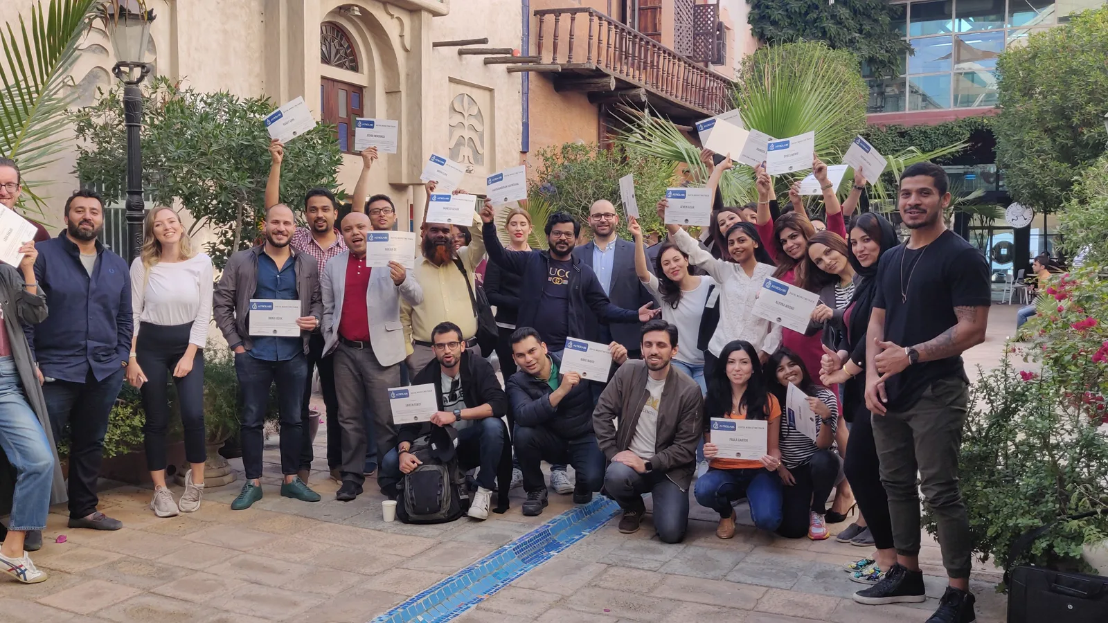 An AstroLabs cohort celebrating with their certificates in Dubai