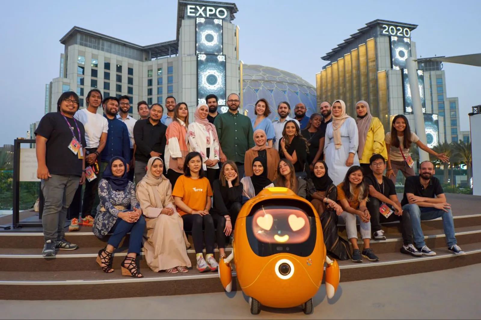 The Expo 2020 Dubai social media team with the Opti mascot at Al Wasl Plaza